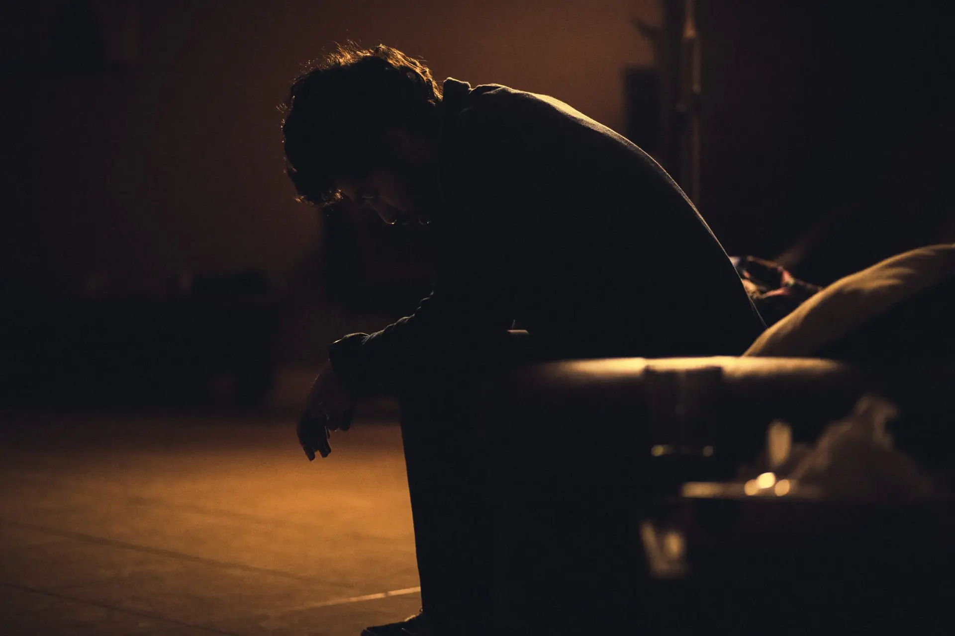 Man sitting in chair appearing sad