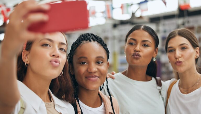 Phone, selfie and gen z friends in university shopping on summer holidays, vacation and having fun