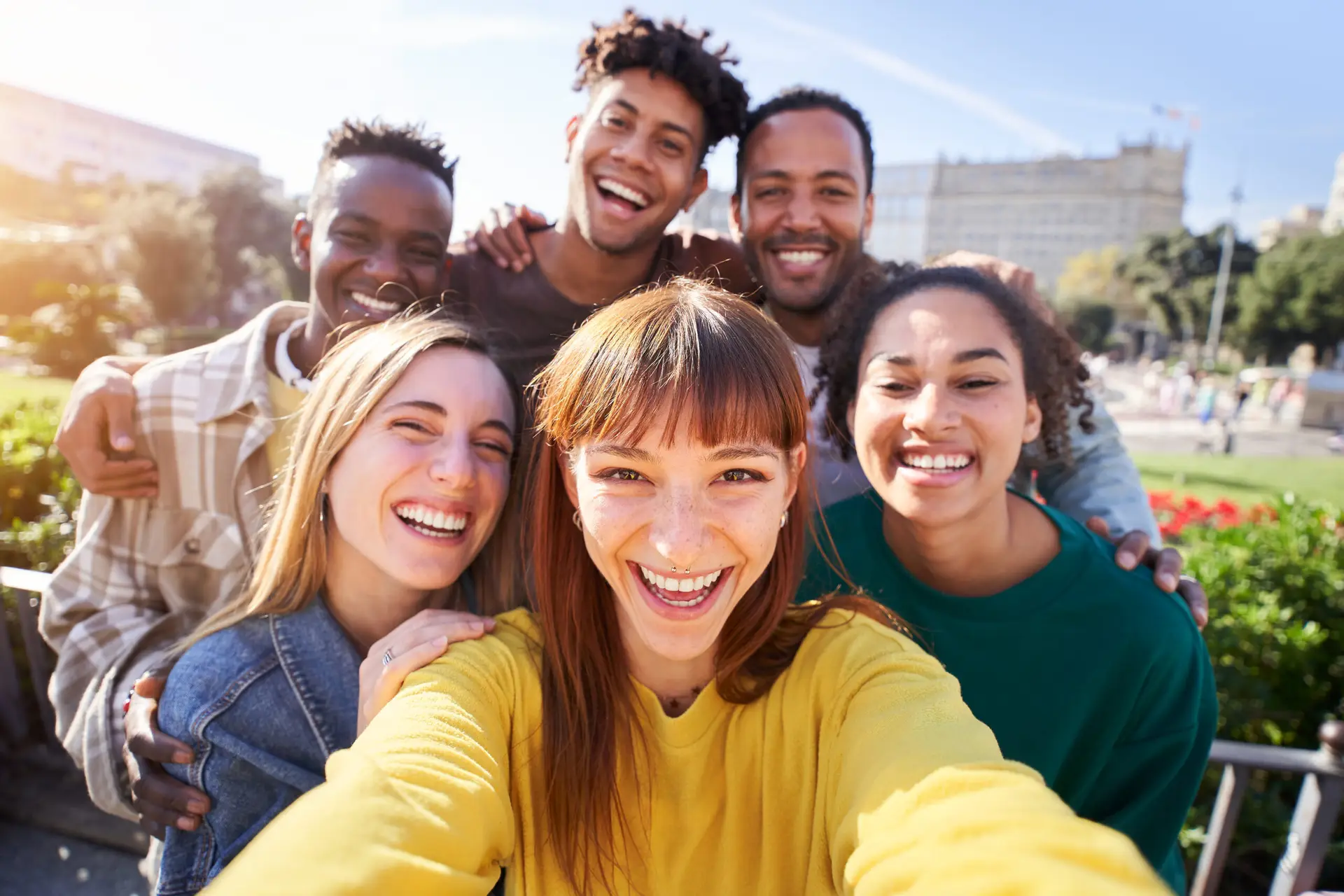 Small group of friends posing for a selfie on a spring day outdoors