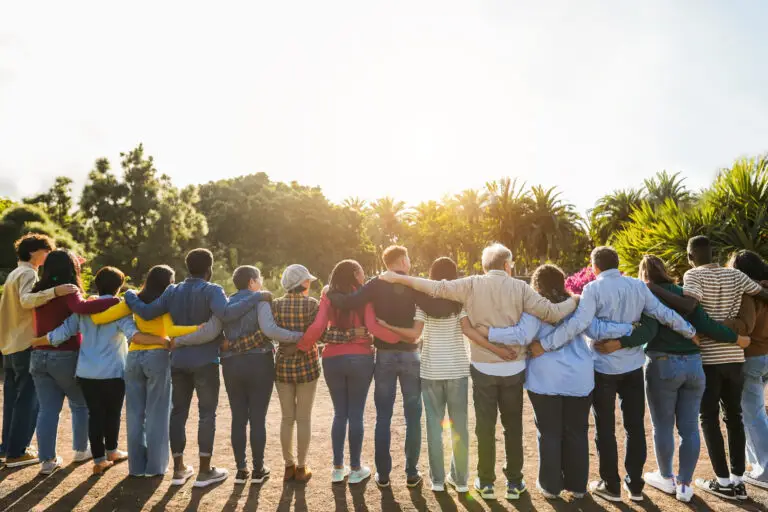 Group of multigenerational people hugging each other