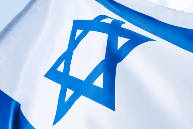 Close up of blue star of David on national flag of Israel