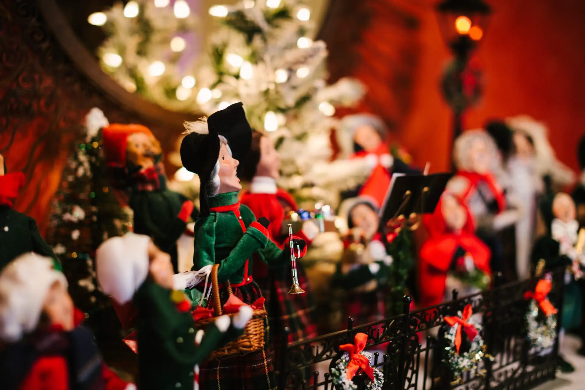 vintage Christmas caroler decorations neatly on display in a home