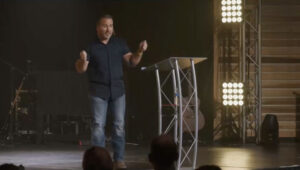 Rick Wright speaking from a church stage on Calling Out the Called Sunday.